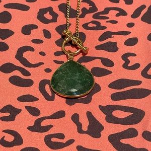 Gold 20” necklace w/ green stone and front toggle clasp.